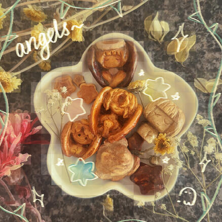 Avocado pit carvings of angels